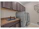 Laundry room with washer, dryer and sink at 12023 Gold Creek Trl, Windermere, FL 34786
