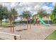 playground with swings and slides at 12023 Gold Creek Trl, Windermere, FL 34786