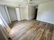 Bedroom with wood-look floors and closet at 1234 Sago Palm Blvd # 1234, Kissimmee, FL 34741