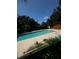 Community pool with surrounding foliage and a pool house at 1234 Sago Palm Blvd # 1234, Kissimmee, FL 34741