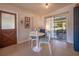 Cozy dining area with white table and chairs, near sliding glass doors at 1313 Malone Dr, Orlando, FL 32810