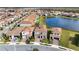 Aerial view showing the home's location in a residential community by a lake at 13333 Oakenshaw Ln, Orlando, FL 32832