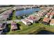 Home situated in a residential community near a lake at 13333 Oakenshaw Ln, Orlando, FL 32832