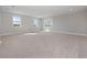 Spacious bedroom with large windows and carpeted floors at 13333 Oakenshaw Ln, Orlando, FL 32832