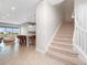 Modern entryway with kitchen and staircase views at 13333 Oakenshaw Ln, Orlando, FL 32832