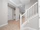 View of entryway with tile floors, white staircase, and access to other rooms at 13333 Oakenshaw Ln, Orlando, FL 32832