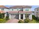Two-story house with gray siding, brown tile roof, and a two-car garage at 13333 Oakenshaw Ln, Orlando, FL 32832