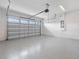 Bright garage with automatic door opener and epoxy floor at 13333 Oakenshaw Ln, Orlando, FL 32832