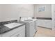 Laundry room with washer, dryer, sink, and cabinets at 13333 Oakenshaw Ln, Orlando, FL 32832