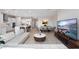 Open concept living space with kitchen, dining area, and large TV at 13333 Oakenshaw Ln, Orlando, FL 32832