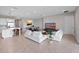 Open living room and kitchen with large island, modern appliances, and tile floors at 13333 Oakenshaw Ln, Orlando, FL 32832