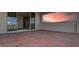 Brick paved patio with glass sliding doors leading to interior; sunset view at 13333 Oakenshaw Ln, Orlando, FL 32832
