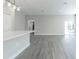 Bright living room featuring gray vinyl plank flooring and sliding glass doors at 1513 23Rd St, Orlando, FL 32805