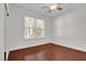 Bedroom with wood floors and large window at 168 Bethel Oaks Ln, Deltona, FL 32738