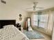 Cozy bedroom with a full-size bed and ample natural light at 2204 San Vittorino Cir # 107, Kissimmee, FL 34741