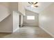 Bright bedroom with ceiling fan, wood-look floors, and a window for natural light at 2827 Euston Rd, Winter Park, FL 32789