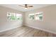 Bright bedroom with two windows and ceiling fan at 2827 Euston Rd, Winter Park, FL 32789