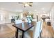 Modern dining area with hardwood floors and a view of the kitchen at 2827 Euston Rd, Winter Park, FL 32789