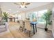 Open concept dining room with hardwood floors and large windows at 2827 Euston Rd, Winter Park, FL 32789