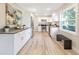 Modern kitchen featuring white cabinets and stainless steel appliances at 2827 Euston Rd, Winter Park, FL 32789