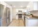 Renovated kitchen featuring stainless steel appliances and white shaker cabinets at 2827 Euston Rd, Winter Park, FL 32789