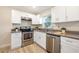 Updated kitchen with stainless steel appliances and gray countertops at 2827 Euston Rd, Winter Park, FL 32789