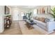 Open concept living room featuring hardwood floors and ample natural light at 2827 Euston Rd, Winter Park, FL 32789