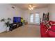 Living room with access to balcony and neutral decor at 304 E South St # 5022, Orlando, FL 32801