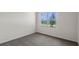 Bright bedroom with grey carpet and large window at 3130 Tobago Dr, Haines City, FL 33844