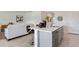 Modern kitchen island with white countertops and gray cabinets at 3130 Tobago Dr, Haines City, FL 33844