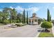 Gated community entrance with a fountain and landscaping at 3632 Serena Ln, Clermont, FL 34711