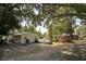 Ranch-style home with carport and mature landscaping at 3910 W Washington St, Orlando, FL 32805