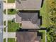 An overhead view of a house and its surrounding neighborhood at 548 Coral Trace Blvd, Edgewater, FL 32132
