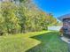 Backyard with grassy area and privacy fence at 548 Coral Trace Blvd, Edgewater, FL 32132