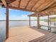 Wooden boat dock with covered area and view of the water at 5516 Remsen Cay Ln, Windermere, FL 34786