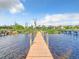 Wooden dock extending into the water at 5516 Remsen Cay Ln, Windermere, FL 34786