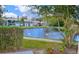 Serene pond view with swans, showcasing the community's natural beauty at 5929 Windhover Dr # A02, Orlando, FL 32819