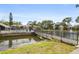 Community pool and footbridge over a serene pond at 5929 Windhover Dr # A02, Orlando, FL 32819