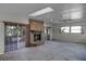 Living room with fireplace, sliding glass doors, and ceiling fan at 613 Banderas Ave, Ocoee, FL 34761