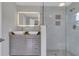 Modern bathroom with double sinks and a glass shower at 7023 Talbot Dr, Orlando, FL 32819