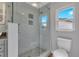 Bathroom featuring a walk-in shower and mosaic tile at 7023 Talbot Dr, Orlando, FL 32819