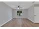 Spacious bedroom with wood-look floors and large window at 7023 Talbot Dr, Orlando, FL 32819