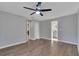Bright bedroom with ceiling fan and wood-look flooring at 7023 Talbot Dr, Orlando, FL 32819