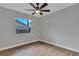 Well-lit bedroom with ceiling fan and wood floors at 7023 Talbot Dr, Orlando, FL 32819