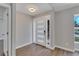 Bright and airy entryway with hardwood floors and modern front door at 7023 Talbot Dr, Orlando, FL 32819
