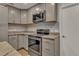 Modern kitchen with granite countertops and stainless steel appliances at 7023 Talbot Dr, Orlando, FL 32819