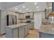 Updated kitchen with granite countertops and island at 7023 Talbot Dr, Orlando, FL 32819