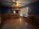 Finished basement with a wet bar, seating area, and wood flooring at 810 E Yorkshire Dr, Deland, FL 32724
