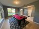 Game room with a pool table and lots of natural light at 810 E Yorkshire Dr, Deland, FL 32724