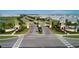 Aerial view of ChampionsGate community, featuring grand entrance and lush landscaping at 8823 Interlocking Ct, Davenport, FL 33896